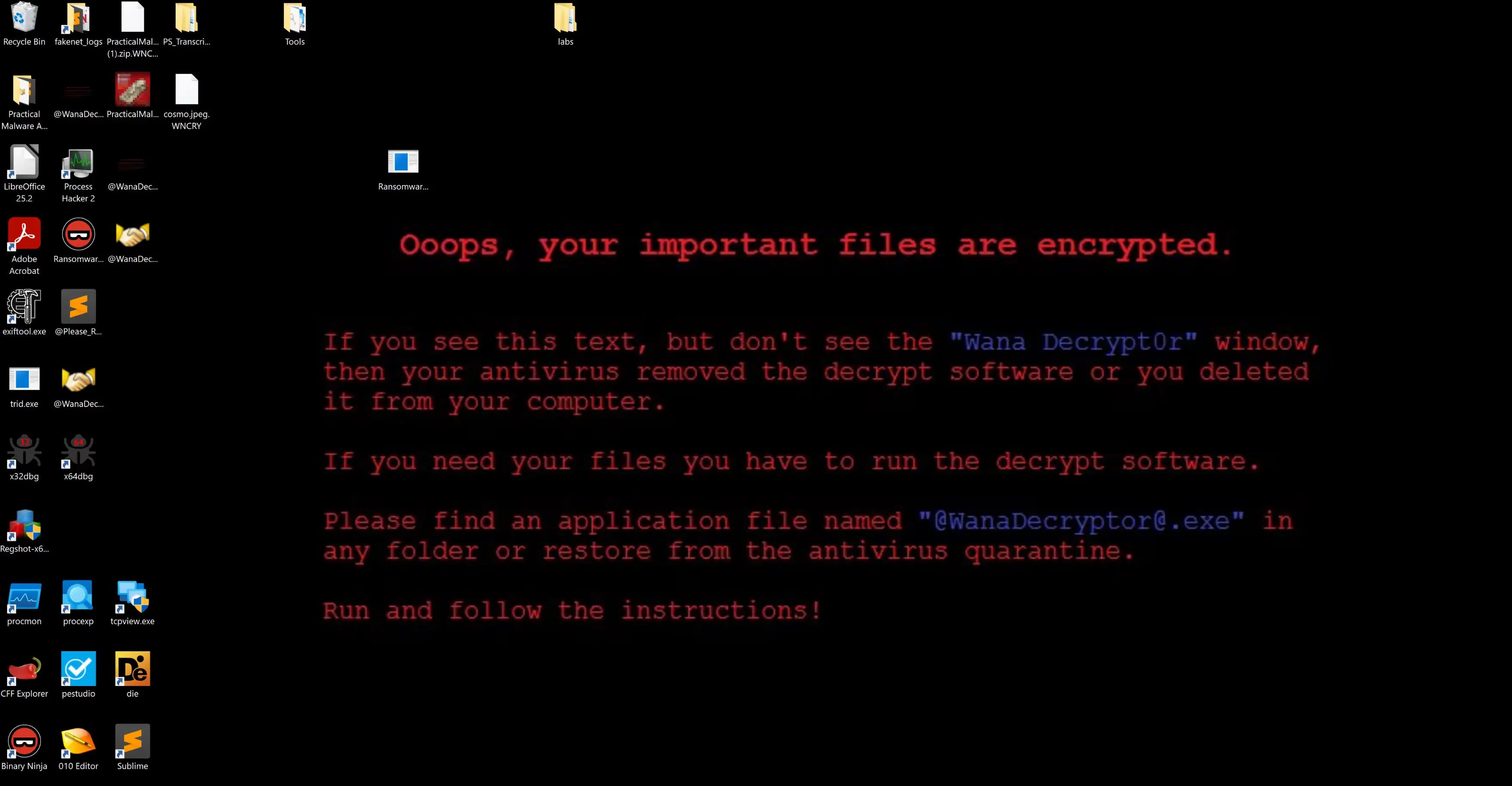 The desktop background written from b.wnry, telling the victim to run @WanaDecryptor@.exe.